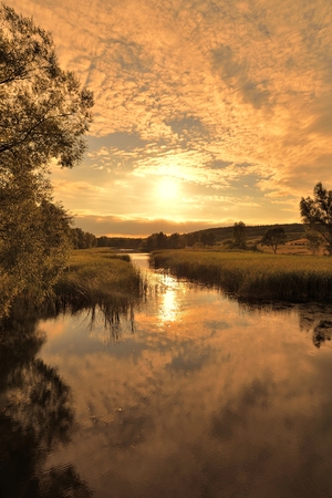 Sunset over river の写真素材