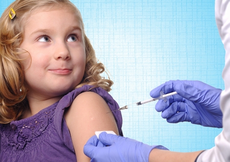 Child vaccinations on blue background.の写真素材
