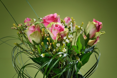 Bouquet of pink roses on green background.の写真素材