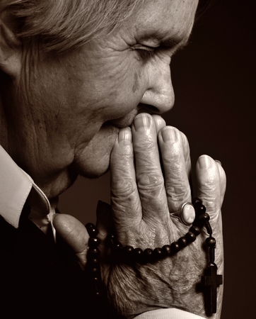 Praying senior woman.の写真素材