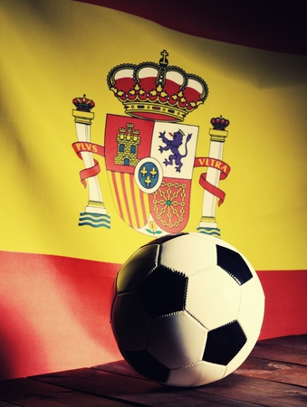 Flag of Spain with football on wooden boards as the background. Vintage Style.の写真素材