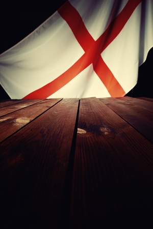 Flag of the England with wooden boards as a background. Vintage Style.の写真素材