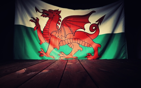 Flag of the Wales with wooden boards as a background. Vintage Style.の写真素材