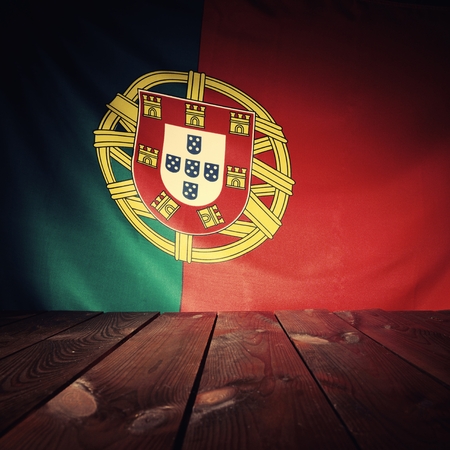 Flag of the Portugal with wooden boards as a background. Vintage Style.の写真素材