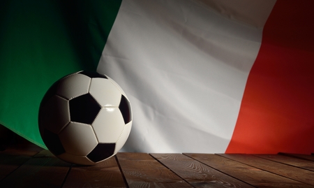 Flag of Italy with football on wooden boards as the background.の写真素材
