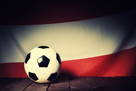 Flag of Austria with football on wooden boards as the background. Vintage Style.の写真素材