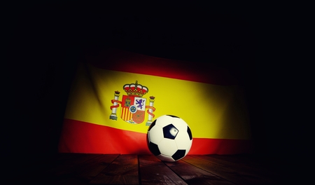 Flag of Spain with football on wooden boards as the background. Vintage Style.の写真素材