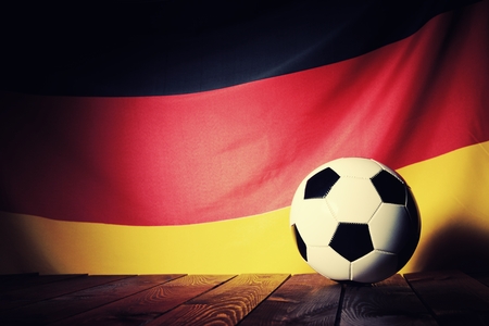 Flag of Germany with football on wooden boards as the background. Vintage Style.の写真素材