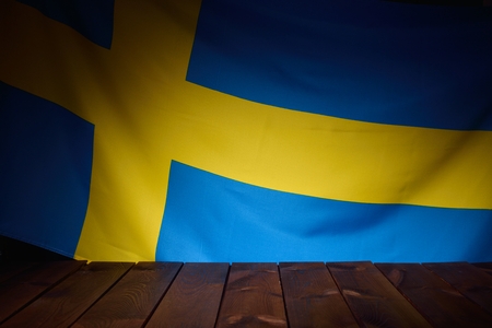 Flag of the Sweden with wooden boards as a background.の写真素材