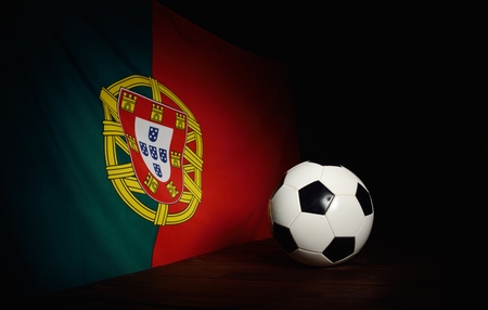 Flag of Portugal with football on wooden boards as the background.の写真素材