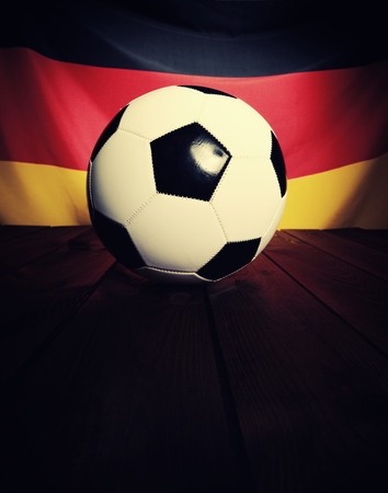 Flag of Germany with football on wooden boards as the background. Vintage Style.の写真素材