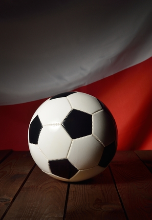 Flag of Poland with football on wooden boards as the background.の写真素材