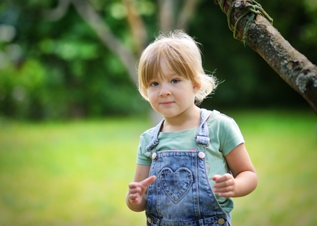 Little girl in park.の写真素材