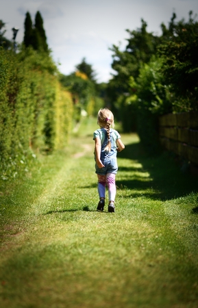 Little girl in park.の写真素材