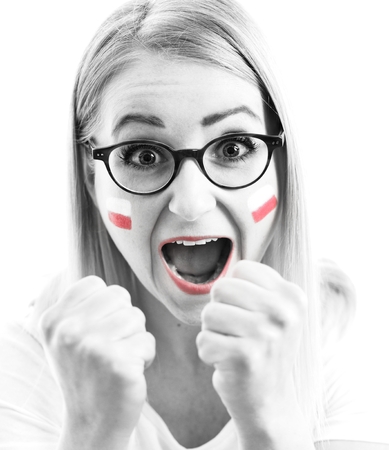 Polish fan cheers football team in the national colors.の写真素材
