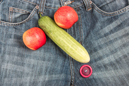 Tomatoes and cucumber in a condomの写真素材