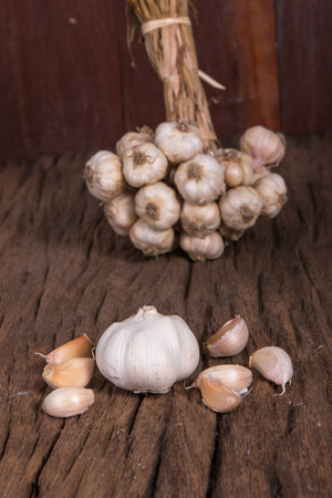 bunch of garlic on woodenの写真素材