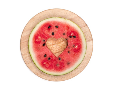 cut watermelon on wooden board isolatedの写真素材