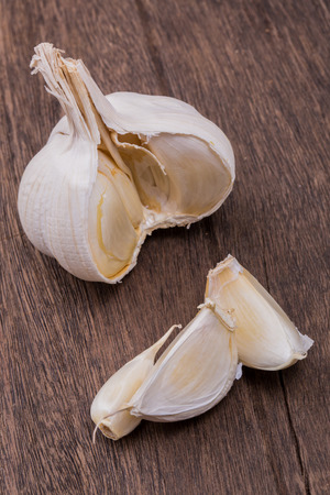 garlic on a wooden tableの写真素材
