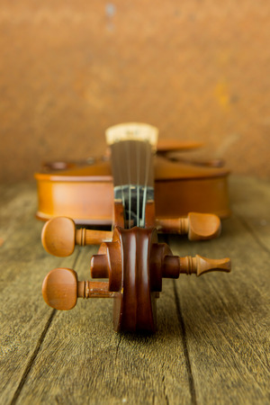 Vintage violin with old steel background with copy spaceの写真素材
