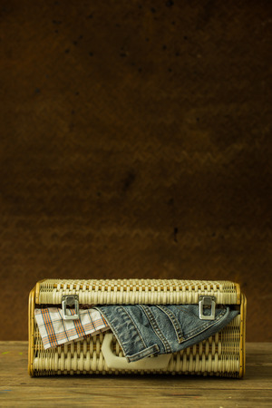 Vintage weave baggage for travel with old steel backgroundの写真素材