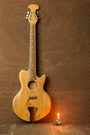 acoustic guitar with lantern on old steel background,still lifeの写真素材