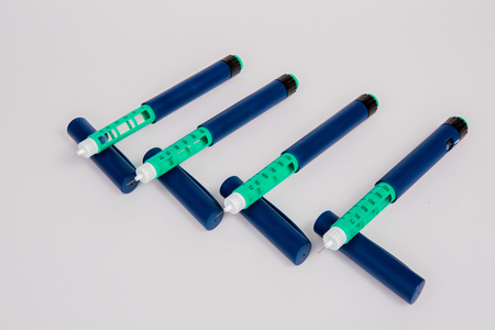 Insulin pen for diabetics on white backgroundの写真素材