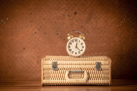 Luggage, clock on old steel background.の写真素材