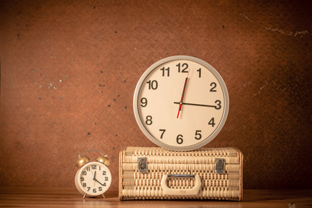 Luggage, clock on old steel background.の写真素材