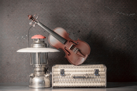 violin with lantern on old steel background,still life,sepia toneの写真素材