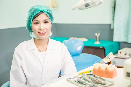 Smiling dentist woman in dental care clinicの写真素材