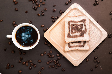 coffee and bread on woodenの写真素材