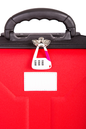 red luggage isolated on the white backgroundの写真素材