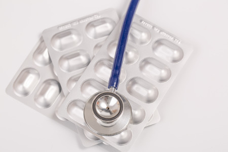 medical drug and stethoscope on white backgroundの写真素材