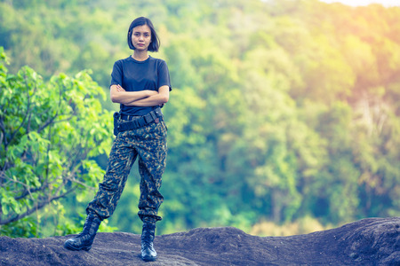 Female soldier on the nature backgroundの写真素材