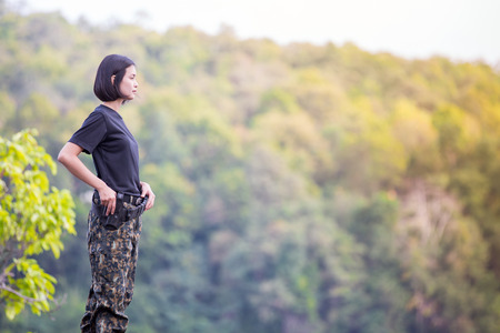 Female soldier on the nature backgroundの写真素材
