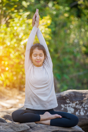 asian woman Yoga - relax in natureの写真素材