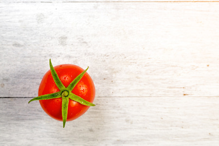 fresh tomato on wooden backgroundの写真素材