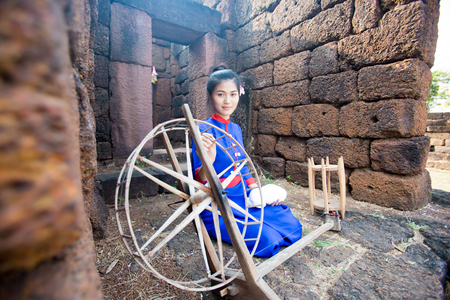Thai women wearing traditional dress with  making cotton silkの写真素材