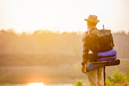 Asian man backpack in nature background, Relax time