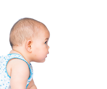 thai baby playing  on white backgroundの写真素材