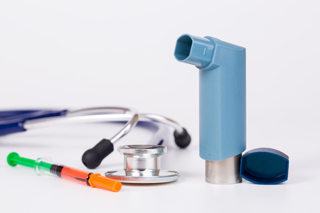 medical tool stethoscope'syring  and asthma inhaler on white backgroundの写真素材