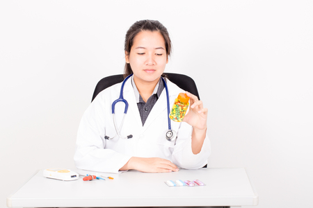 Doctor woman with medical tool on white background.の写真素材