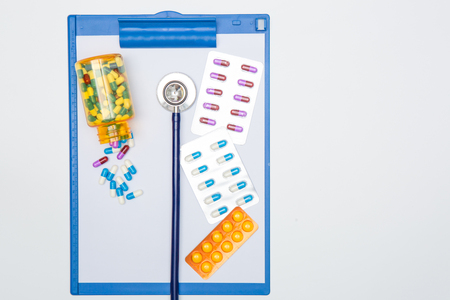 medical drug and stethoscopel on chart on white background.の写真素材