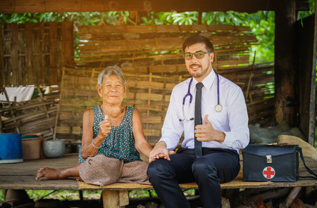 Family medicine visits the  elderly woman in ruralの写真素材