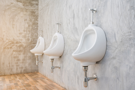 white urinal  On The Concrete Wallの写真素材