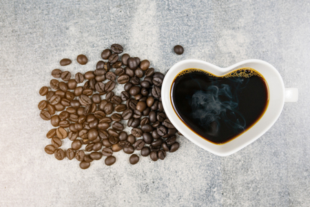 top view of coffee cup heart shape and coffee bean on concrete backgroundの写真素材
