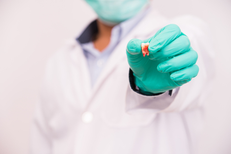 dentist holding removal caries toothの写真素材