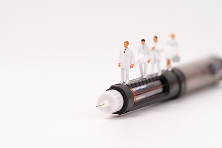 miniature health care team and medical tool,insulin pen and glucometerの写真素材