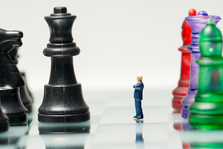 miniature business people with colorful glass chess,business conceptの写真素材